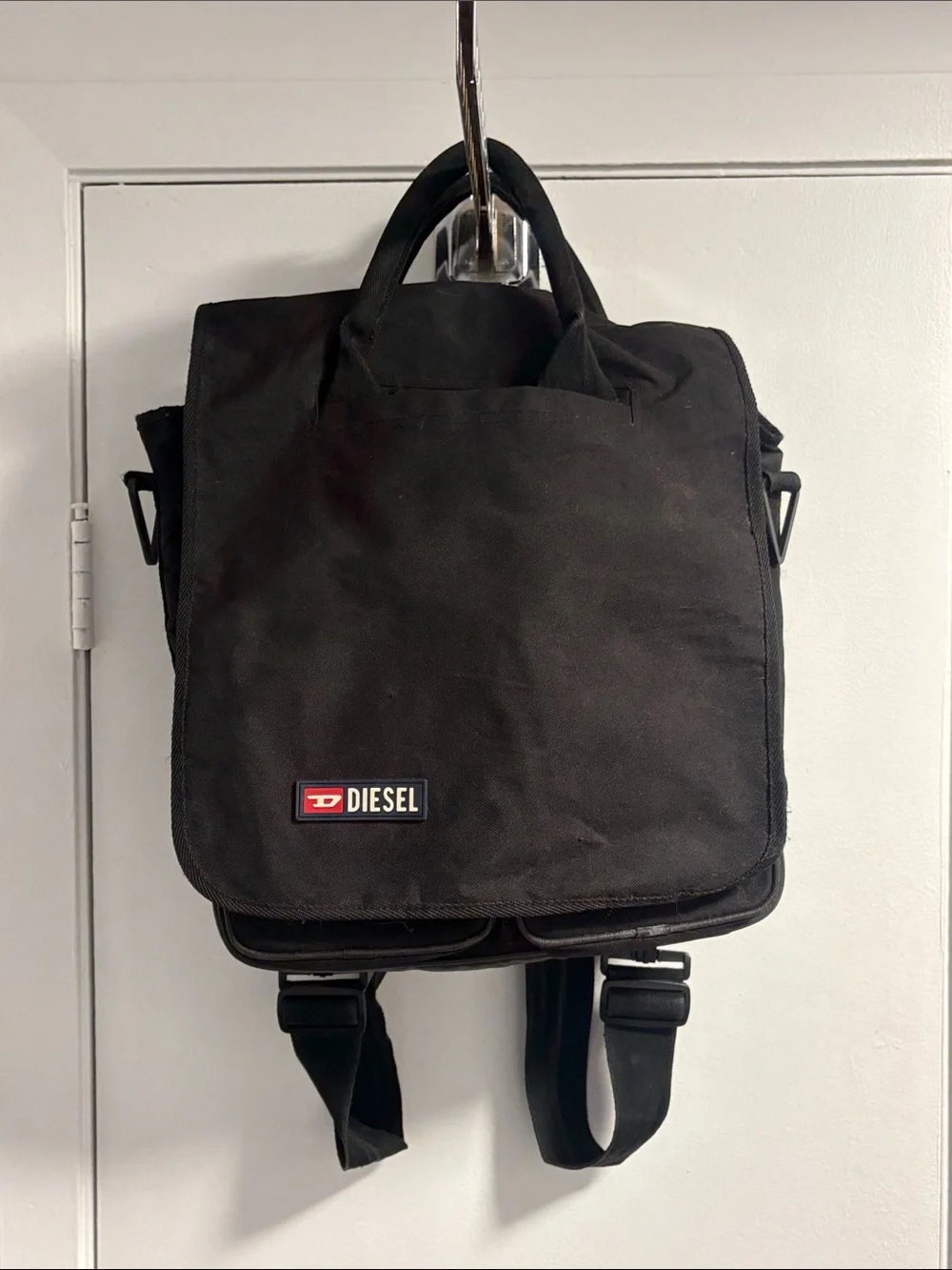 Diesel Vintage Black Canvas Backpack with Red Logo Accent.